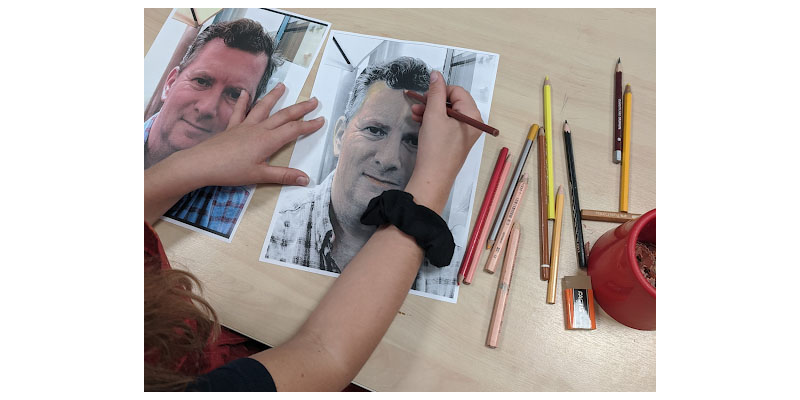 student working on a portrait