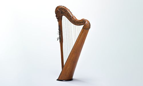 A tall wooden harp