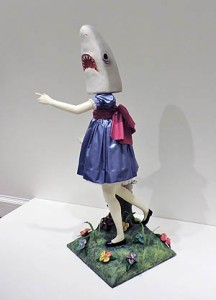 Casey Riordan Millard’s Shark Girl, statue of a girl wearing a blue dress with a shark head in place of a normal human head