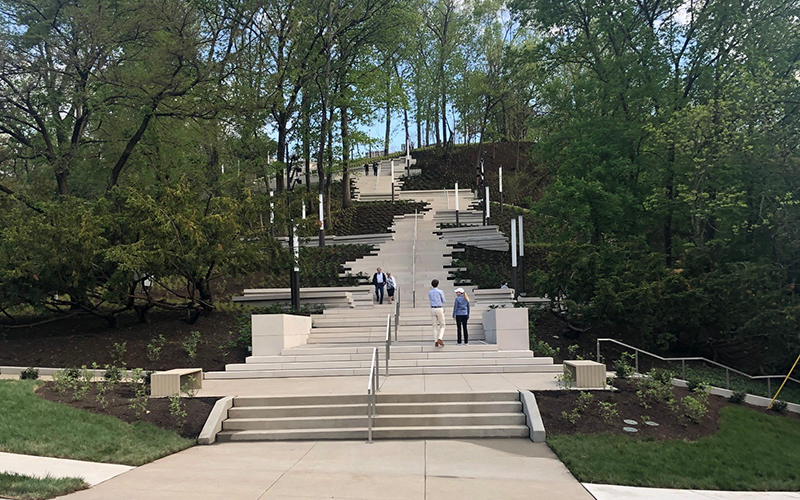 The Art Climb is a series of stairs, landings, and tables with art and greenery