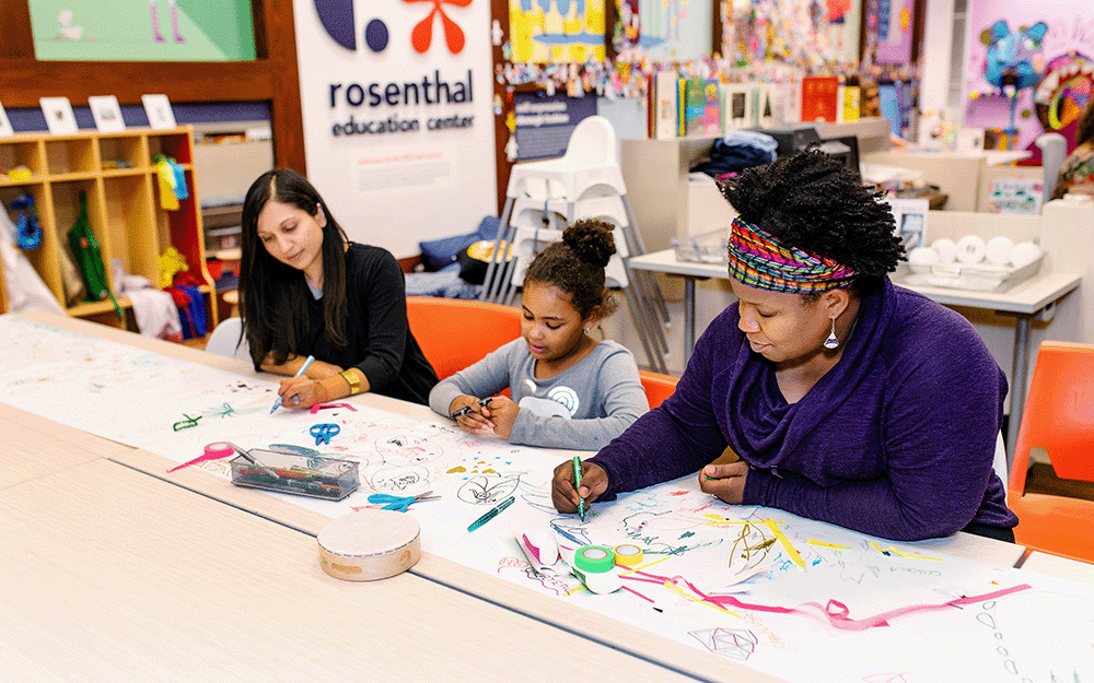 A family makes art together in the Rosenthal Education Center