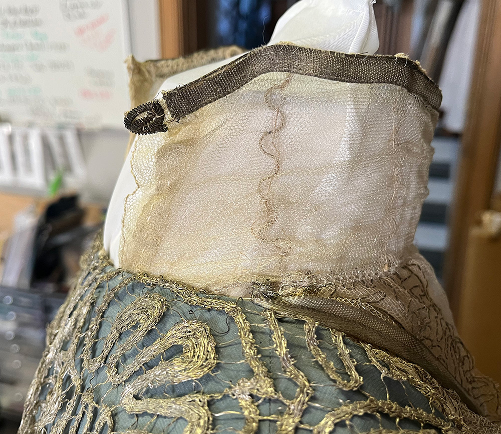 The repaired collar on a dress form
