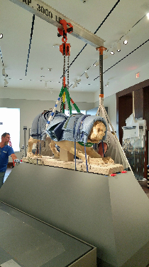 Stone lion lifted onto a new pedestal 