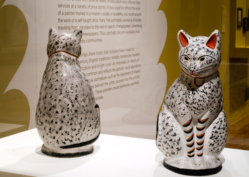 two sculptures of cats