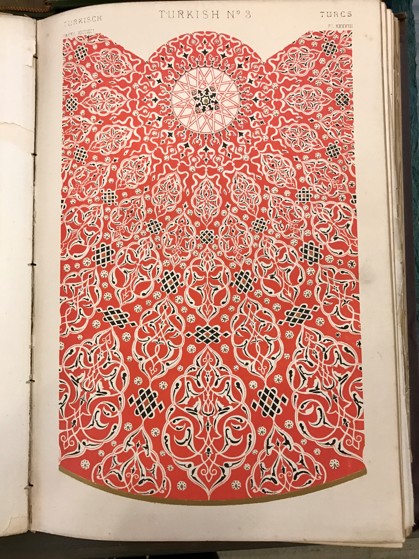 page with red, geometric and floral design