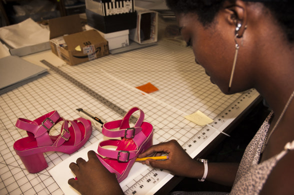 Phoenix Brown working on shoes