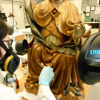 sculpture of St. Peter undergoing cleaning