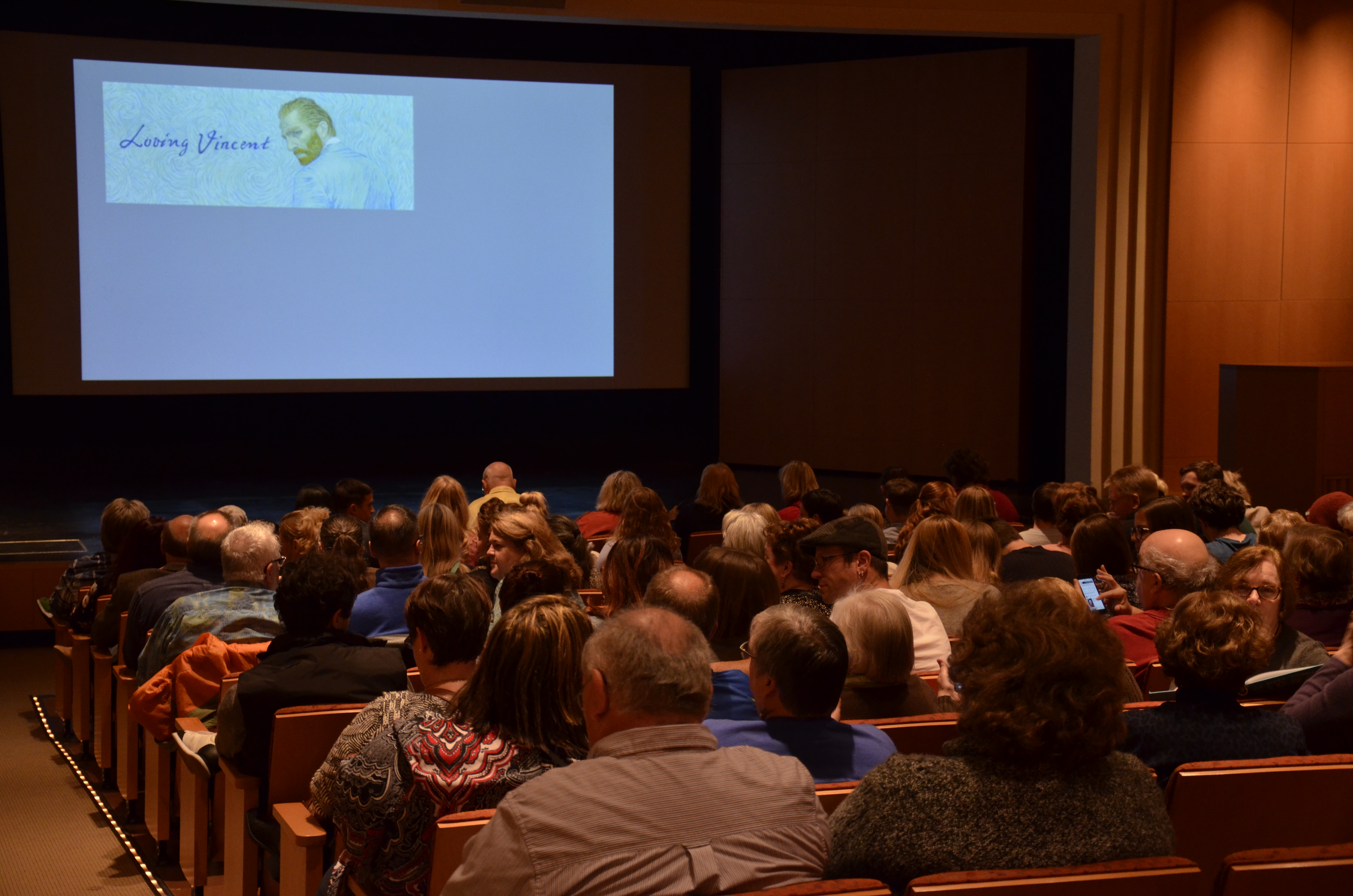 Visitors in the Fath Auditorium awaiting a presentation