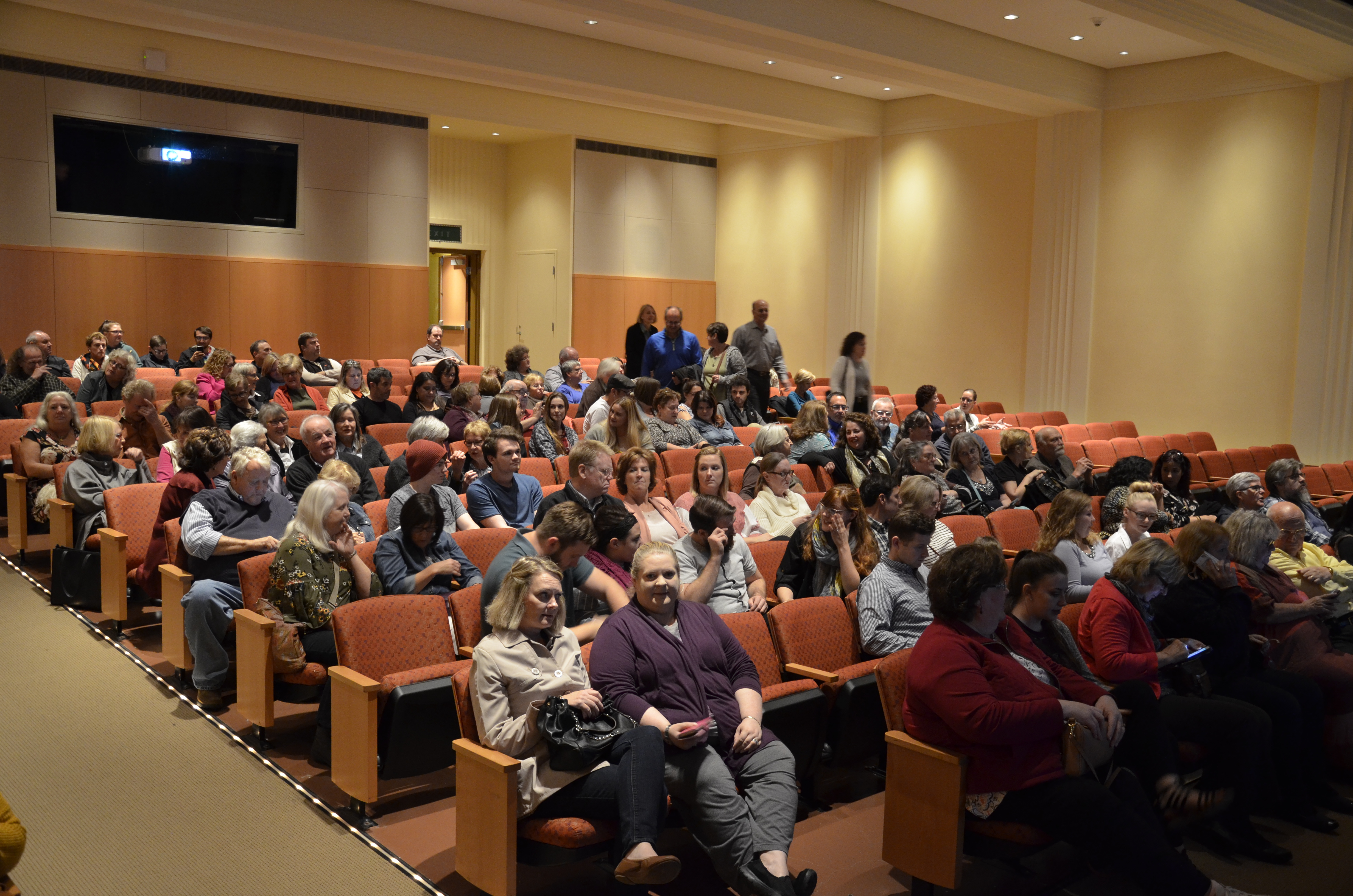 Visitors in the Fath Auditorium awaiting a presentation