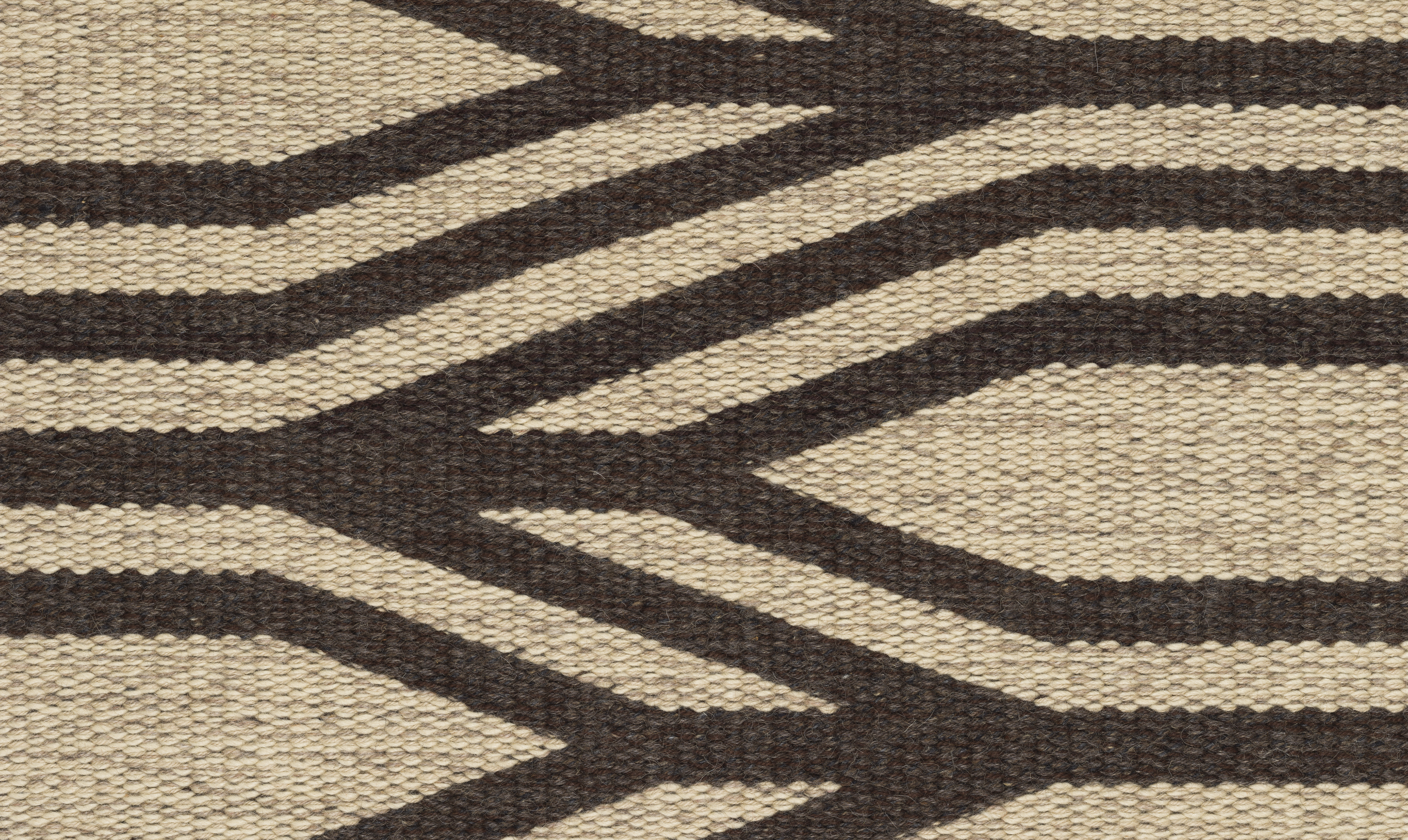 Jane Busse's Branches, a close up photograph of thick woven lines intersecting in a rigid pattern