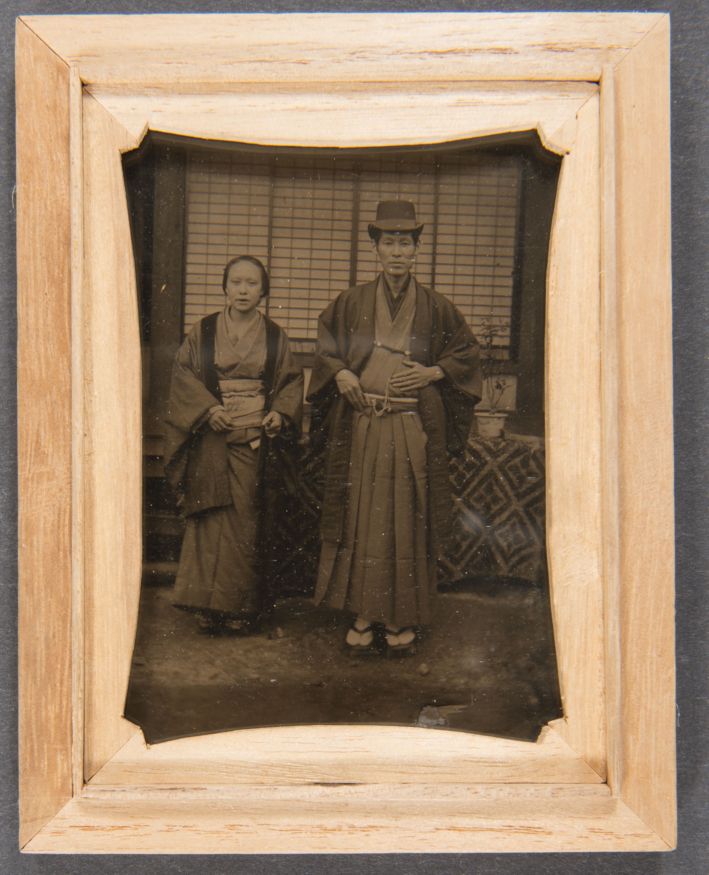 sepia toned photograph of a Japanese man and woman