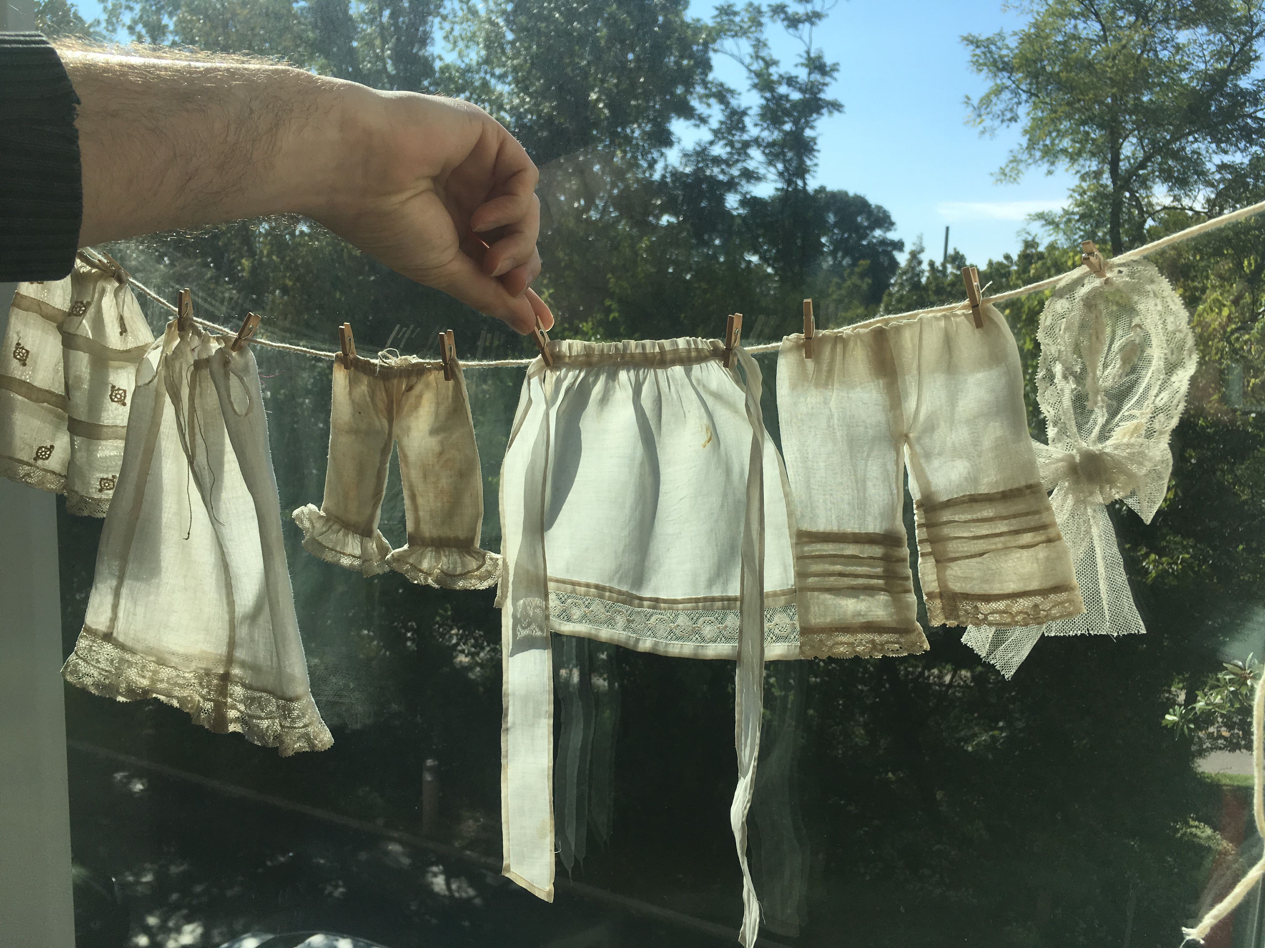 doll clothing on a clothes line