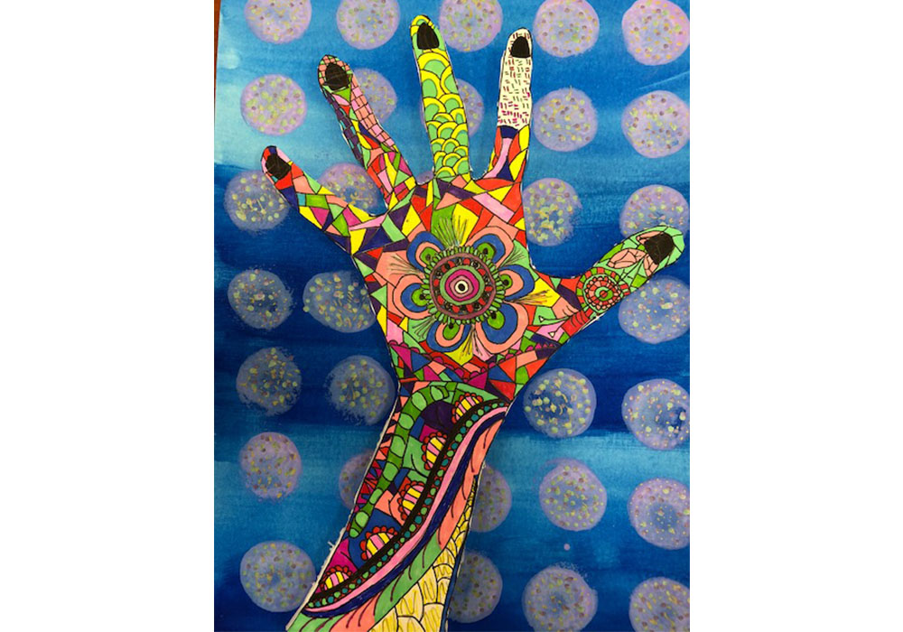 drawing of a colorful and intricately decorated hand