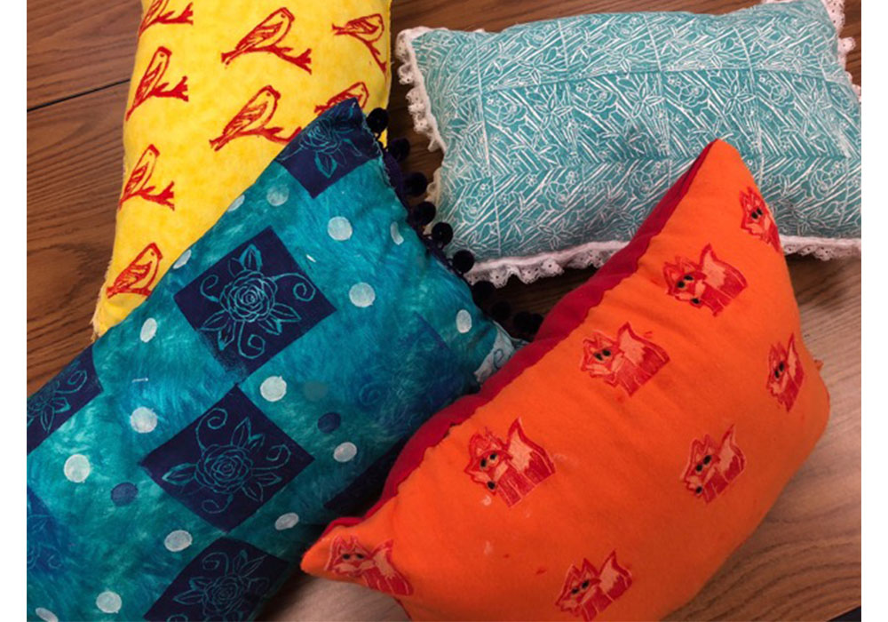 pillows with various various decorated textiles