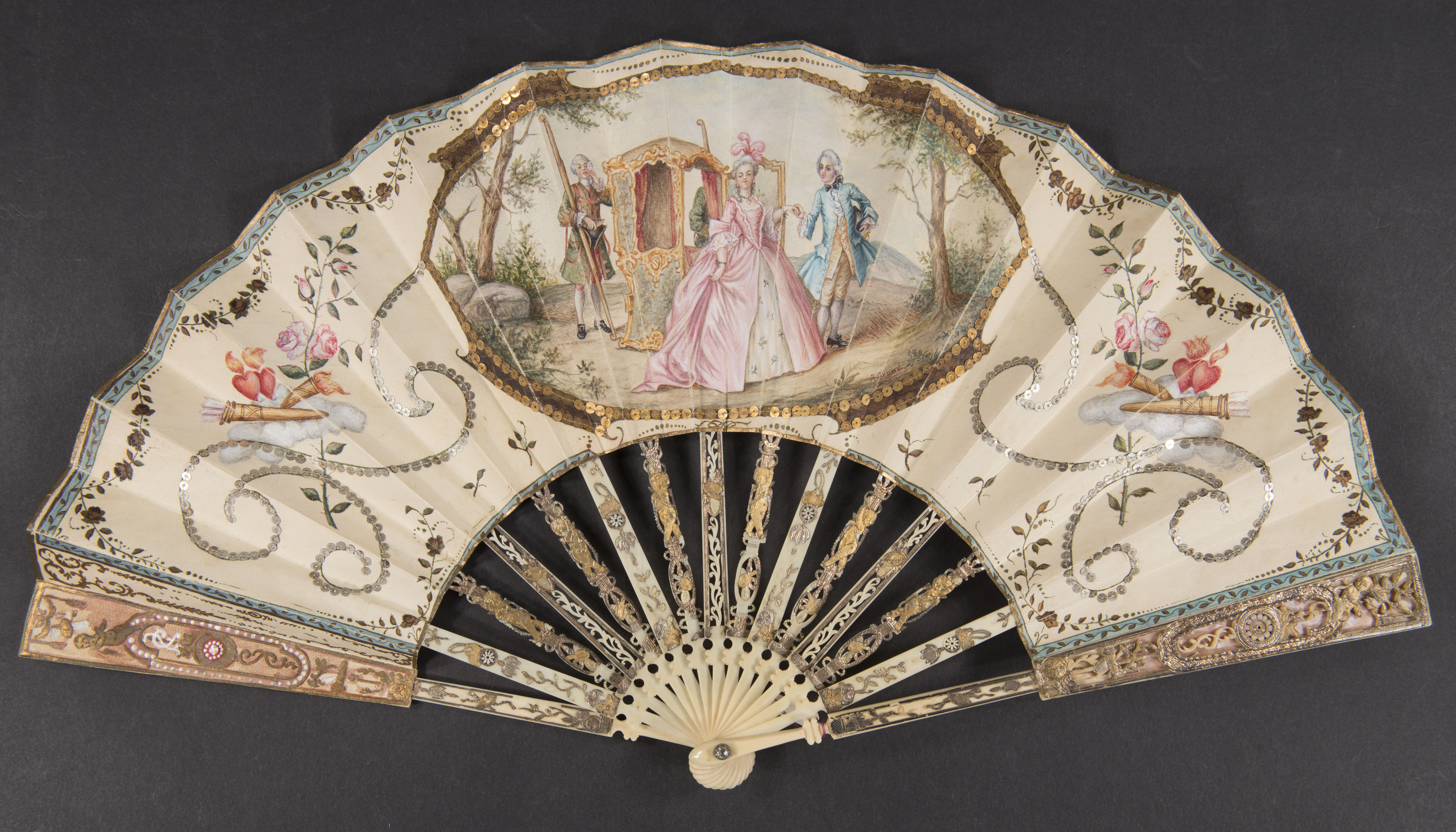 ornate hand fan with a painting of a woman in a luxurious pink dress accompanied by two men in dress attire
