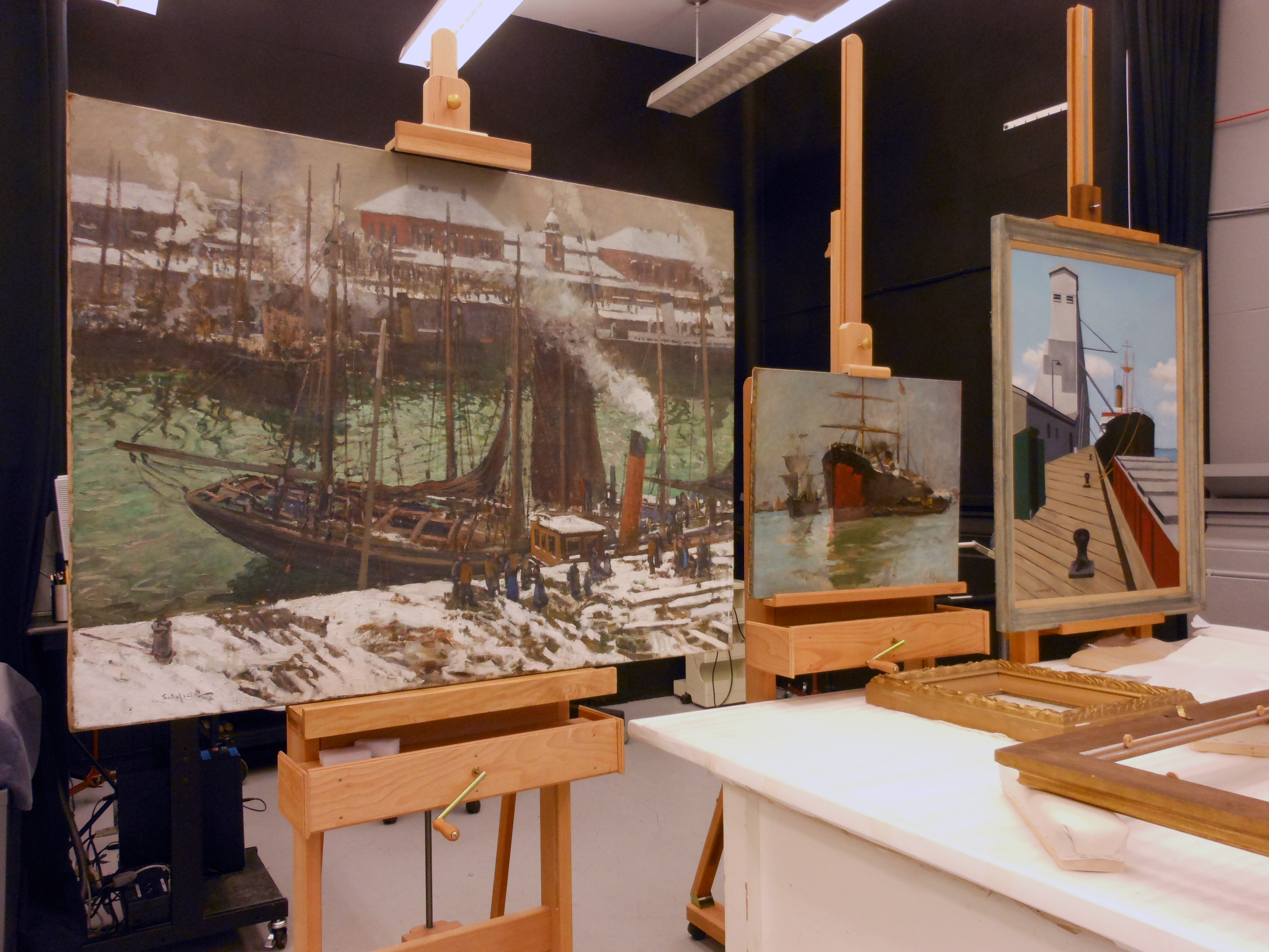 three paintings in conservation