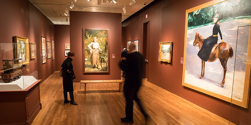 Visitors admire the various artwork in the exhibition 