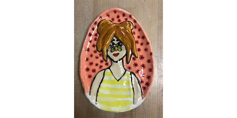 painted ceramic portraits made by students