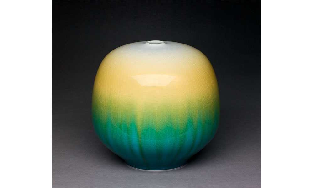 Yasokichi Tokuda IV's Jar, a round jar with a small opening at the top glazed with a white, yellow, green, and blue gradient