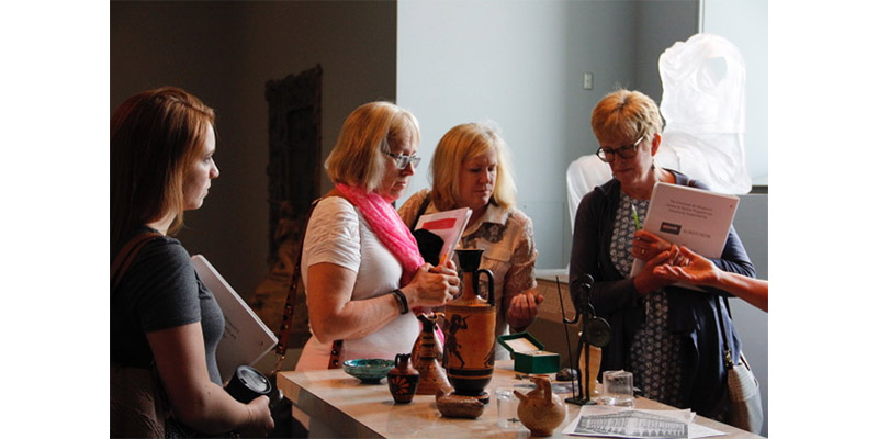 Teachers admiring various Greek artifacts