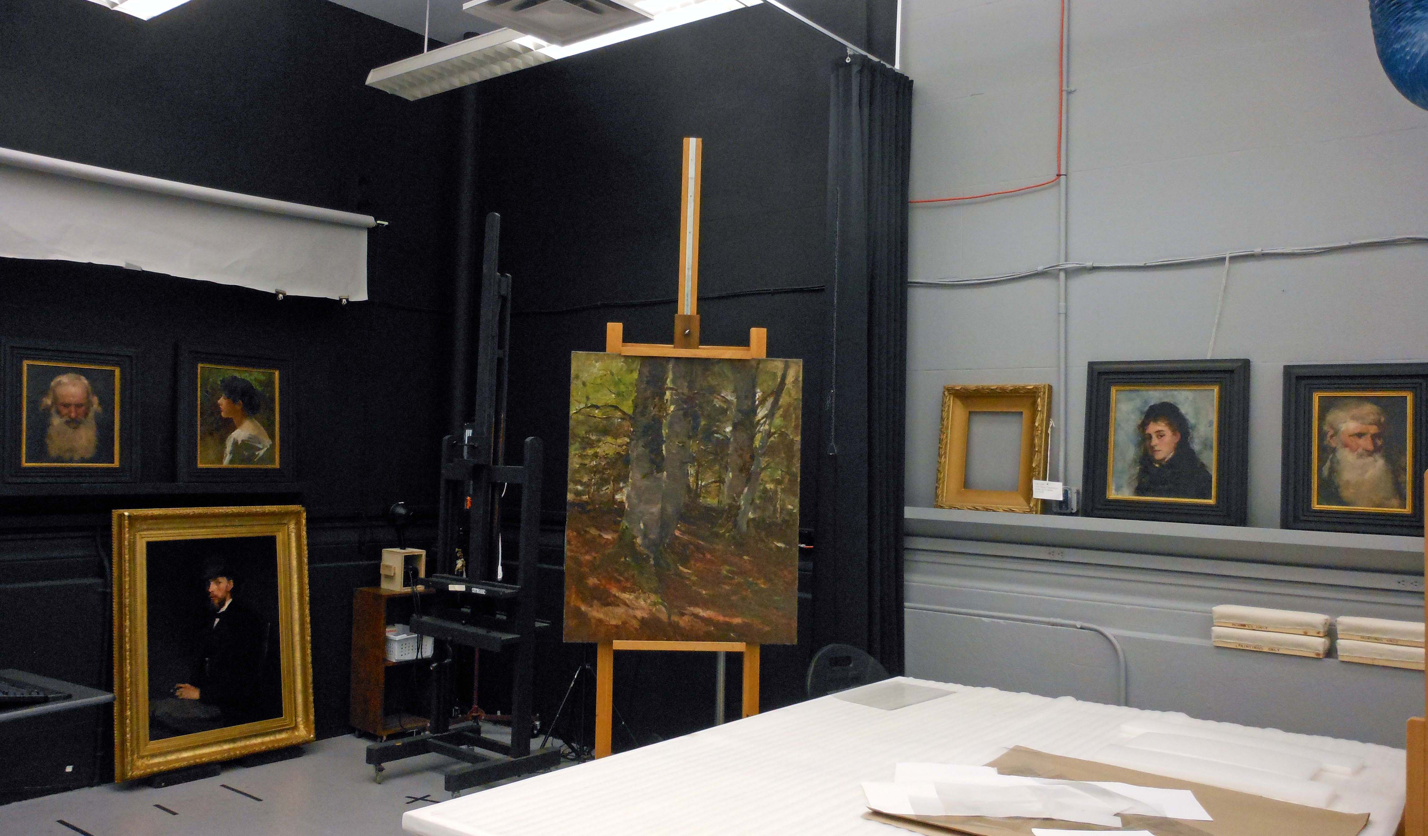 various paintings in the conservation lab