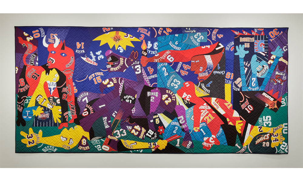 Hank Willis Thomas' Guernica, a remake of the Pablo Picasso painting of the same name, using various sports jerseys cut into the forms and shapes, and fashioned into a quilt