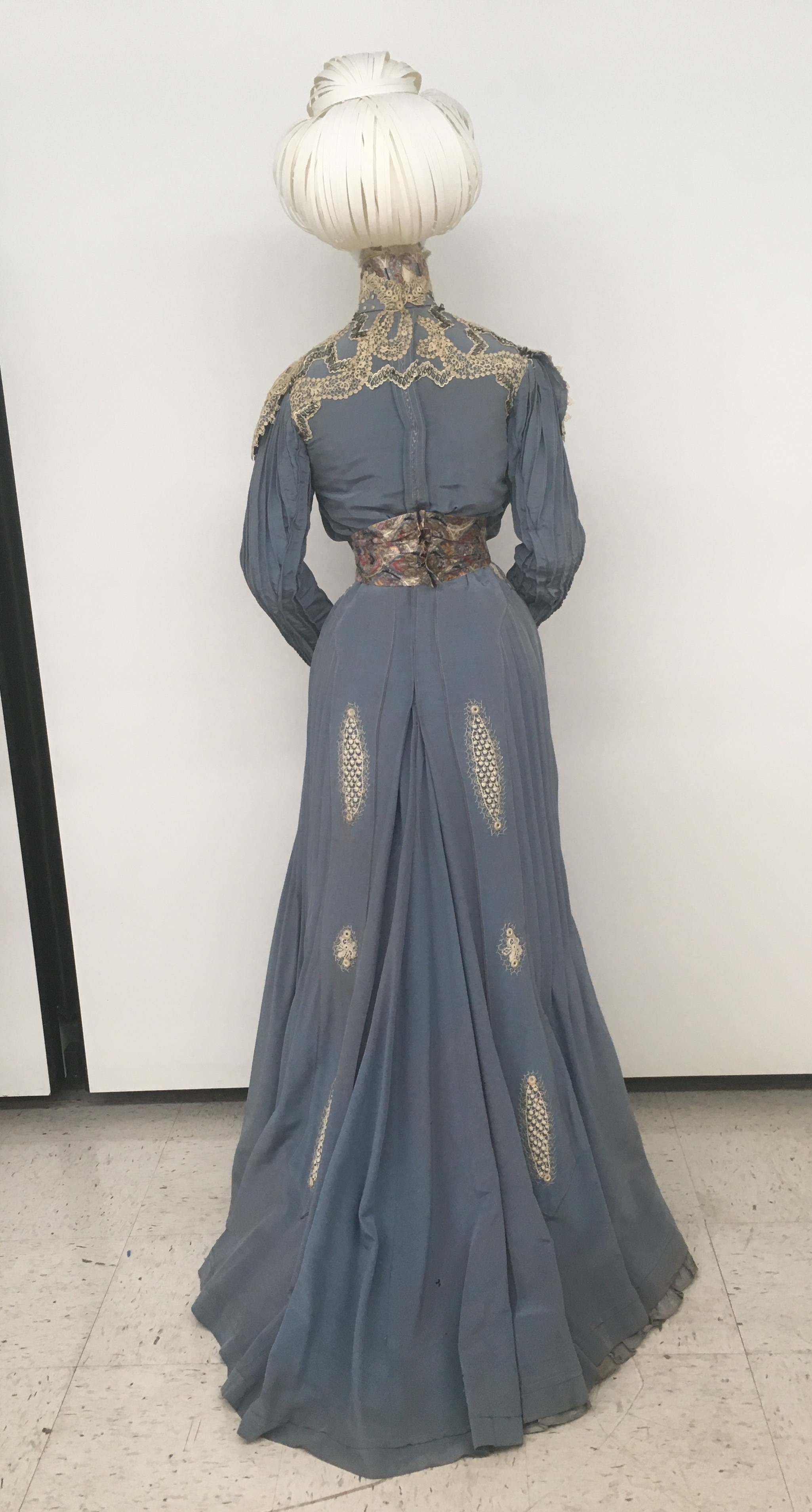 long blue dress with white embroidery