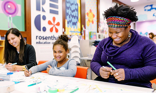 Visitors work on arts and crafts 