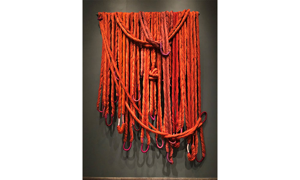 Sheila Hicks' Untitled Tapestry, thick strands of orange linen loosely hung 