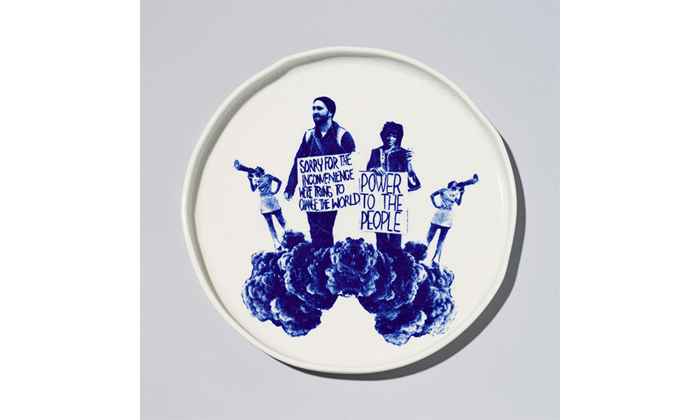 Terence Hammonds' Protest Platter,  a round ceramic plate with an image of protestors carrying signs and walking on clouds in a blue glaze