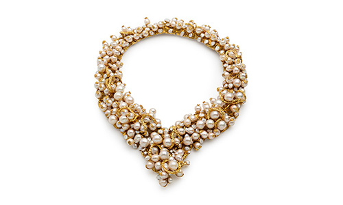 clusters of pearls woven with coarse gold and studded with diamonds.