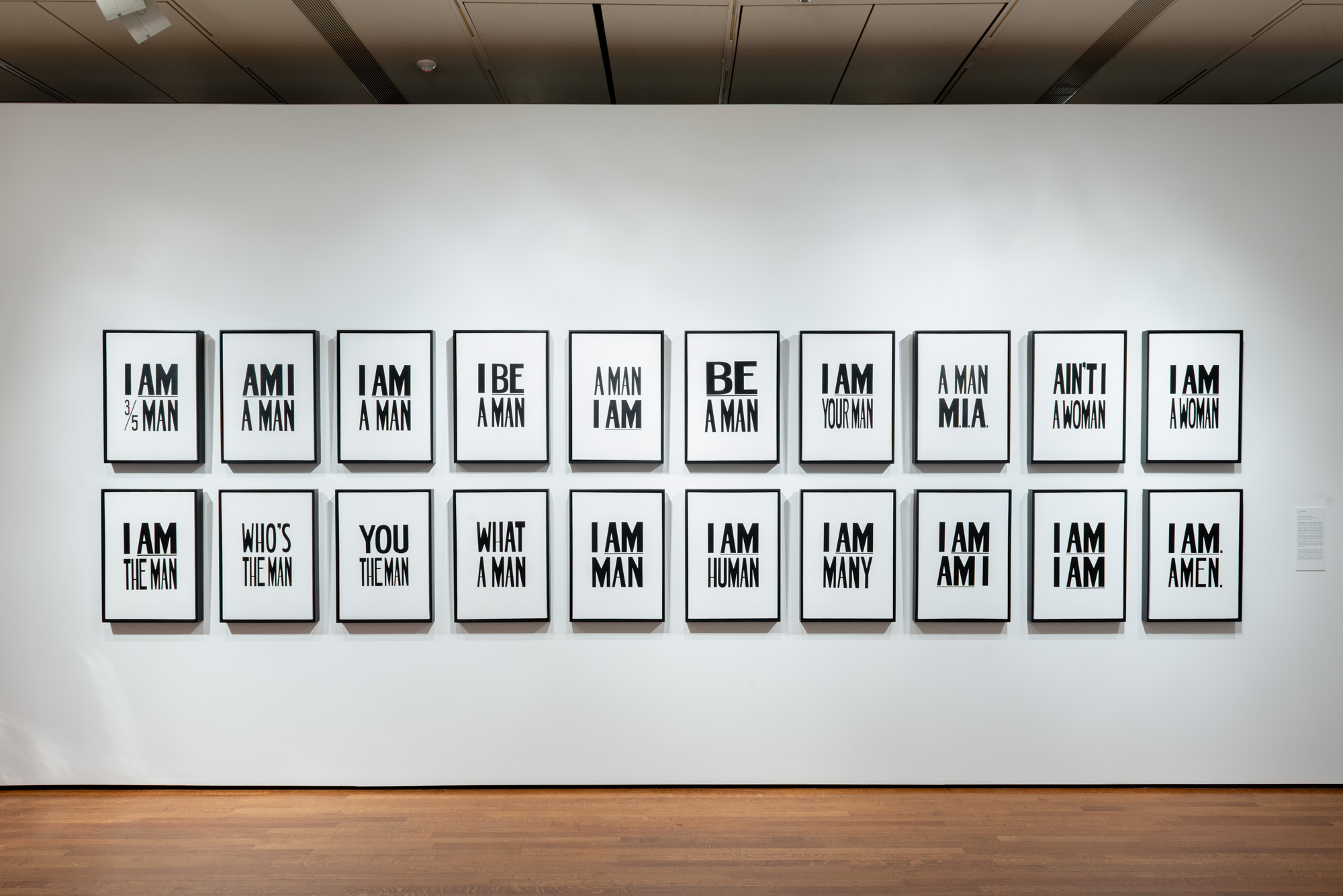 Hank Willis Thomas' I Am. Amen. A series of twenty prints in bold lettering with various phrases such as: I am a man, I be a man, A man am I, and so forth