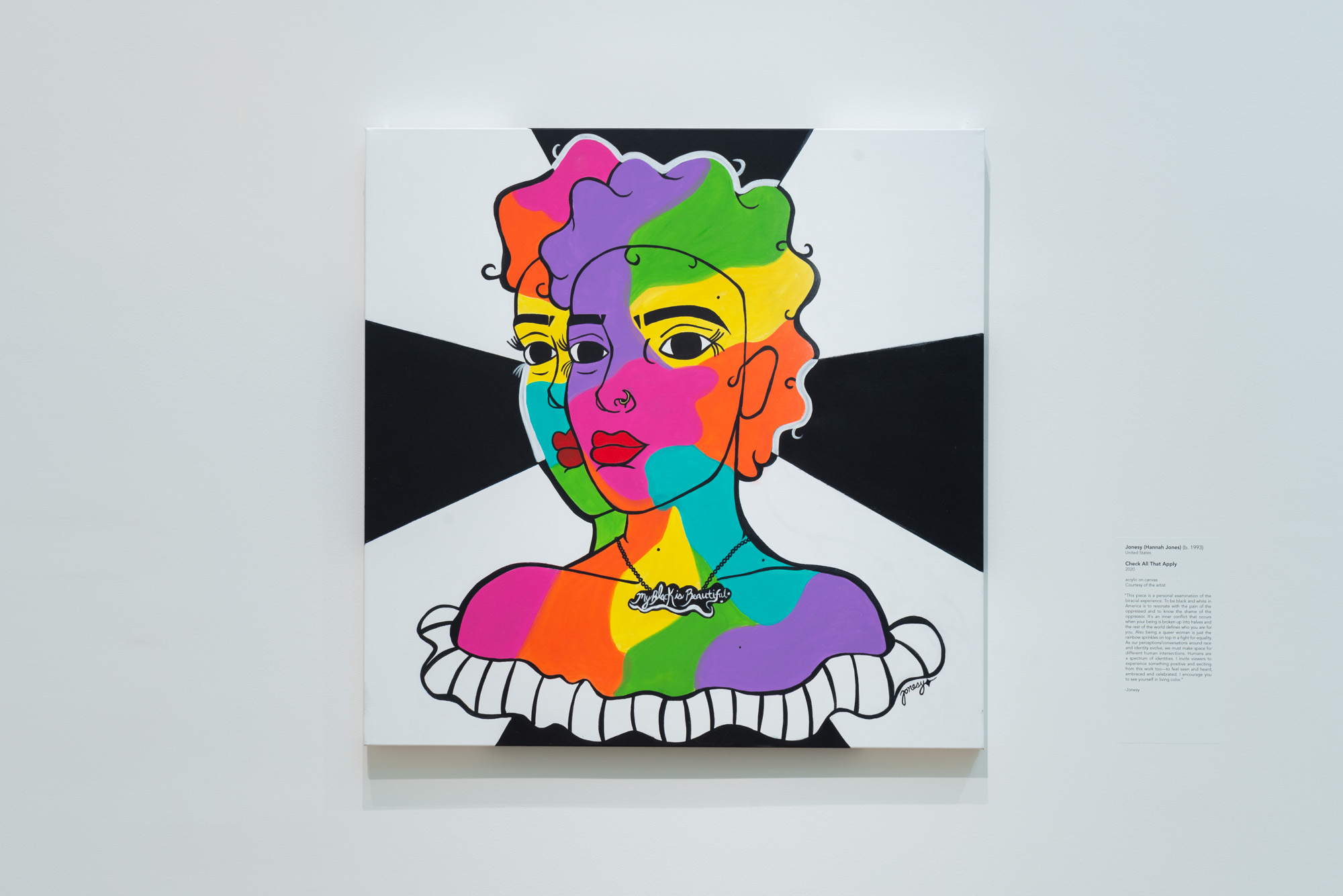 Jonesy's Check All That Apply, a square painting of the bust of a woman. The right side of her face appears a second time shifted just slightly to the left as if to peer over her right shoulder. The woman is filled in with a collage of vivid colors and bright red lipstick. Four black bars appear from behind her and stretch out to the top, bottom, left, and right sides of the painting.