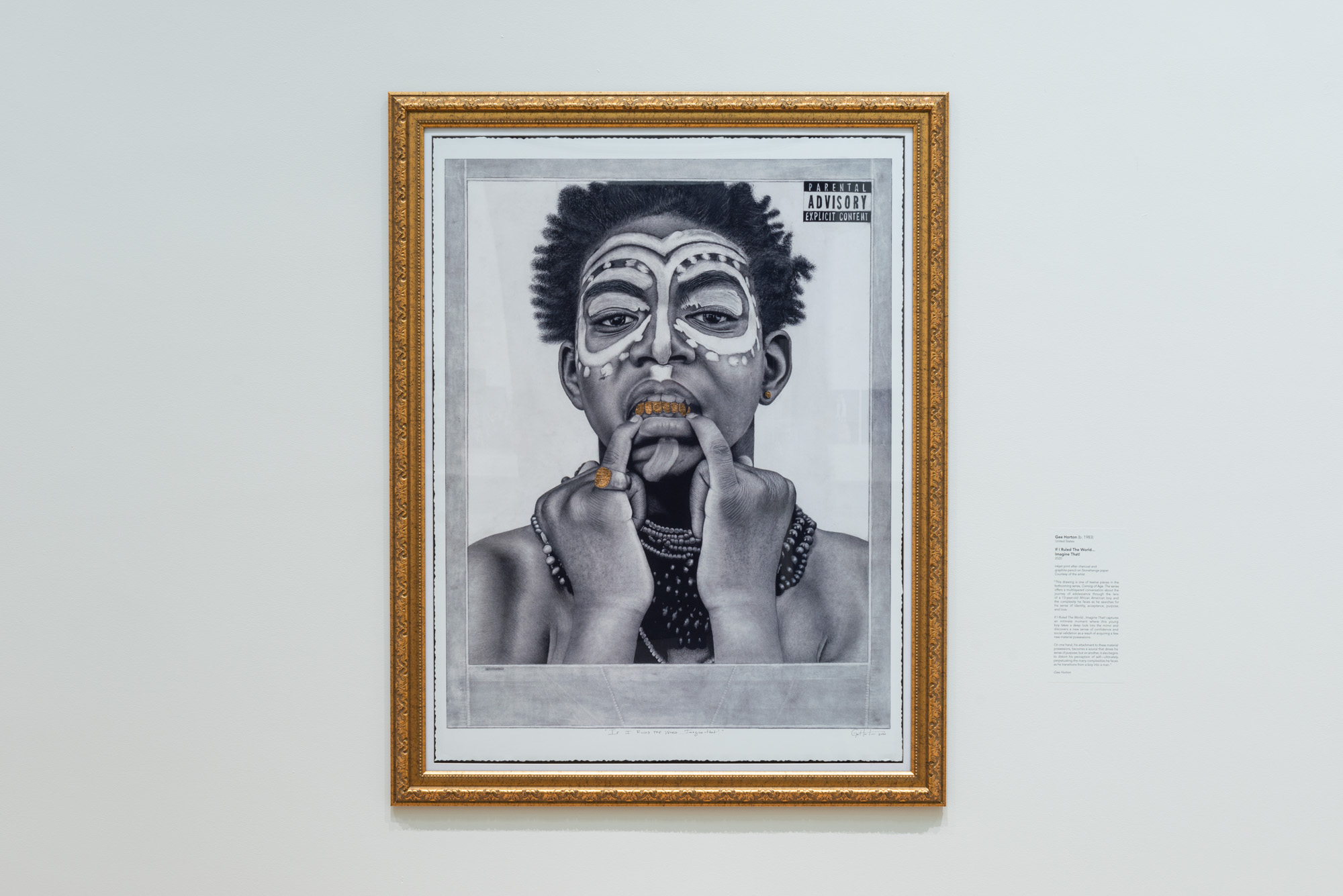 Gee Horton's If I Ruled The World...Imagine That!, a charcoal portrait of an African American man wearing traditional face paint, necklaces, and a gold pinky ring. The mad uses his two pinky fingers to pull his bottom lip down revealing a line of gold teeth. In the top right corner is a Parental Advisory sticker 