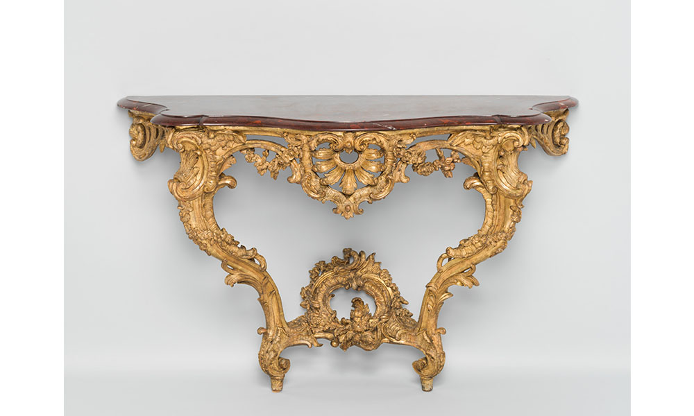Console Table, a side table with ornately carved golden supports