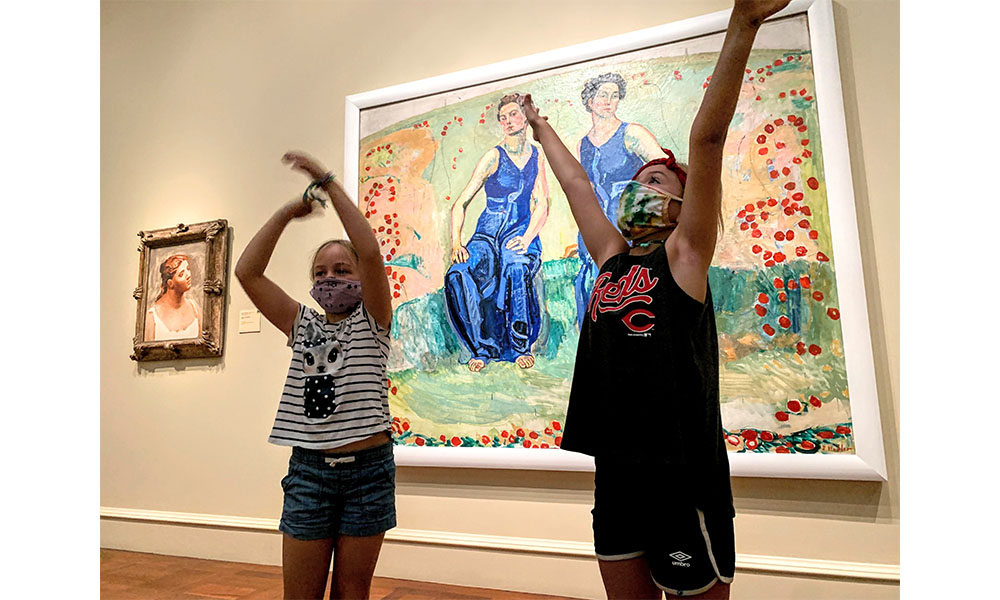 Two campers posing in an exhibition