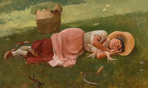 a woman sleeping in a green field