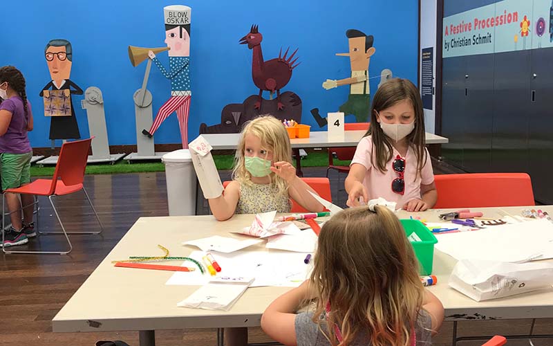 Children work on arts and crafts in Rosenthal Education Center