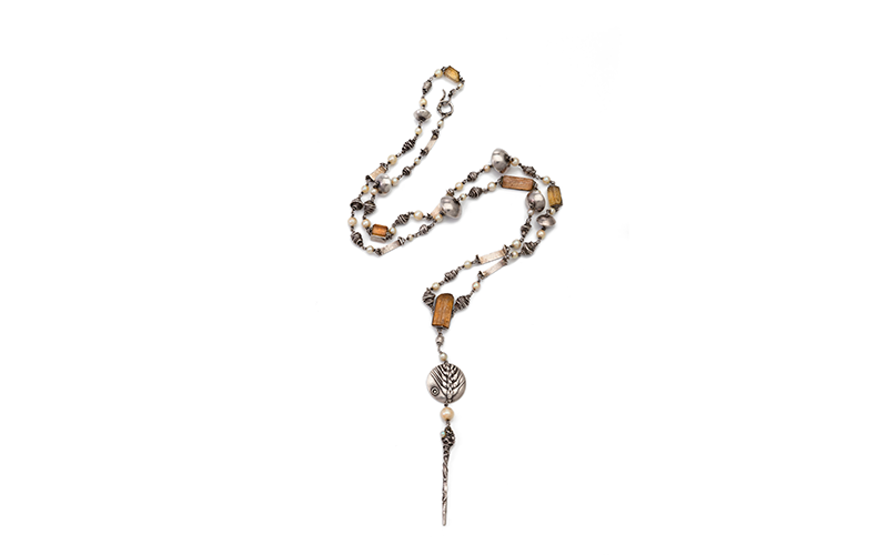 Gerda Flöckinger's Necklace, a long, silver necklace with pearls, topaz.