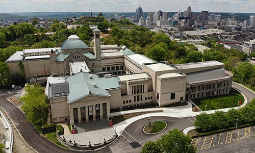 A view from above of the Cincinnati Art Museum, with downtown Cincinnati visible in the distance