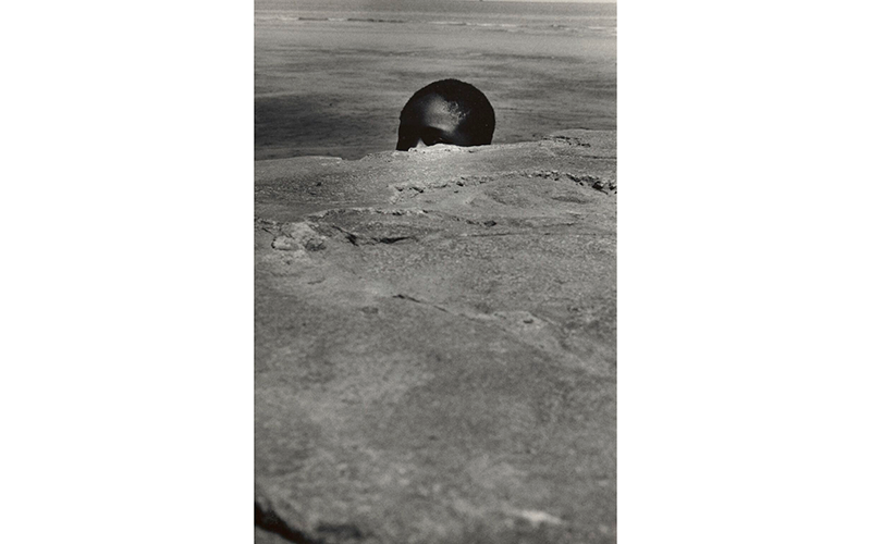 111 James Mannas Jr., Peeping Seawall Beach Boy-Sea Wall, Georgetown, Guyana, 1972