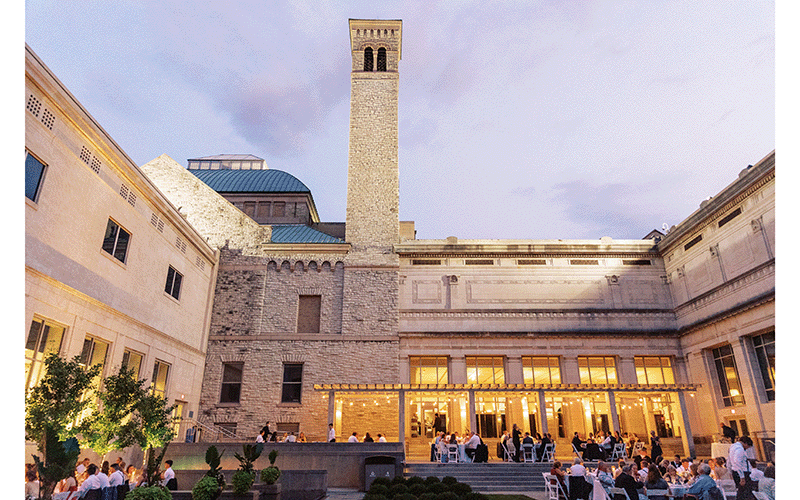 The courtyard at sunset, with a group of people