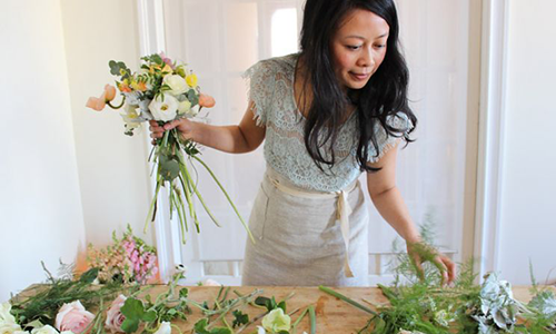 Doan Ly arranges flowers
