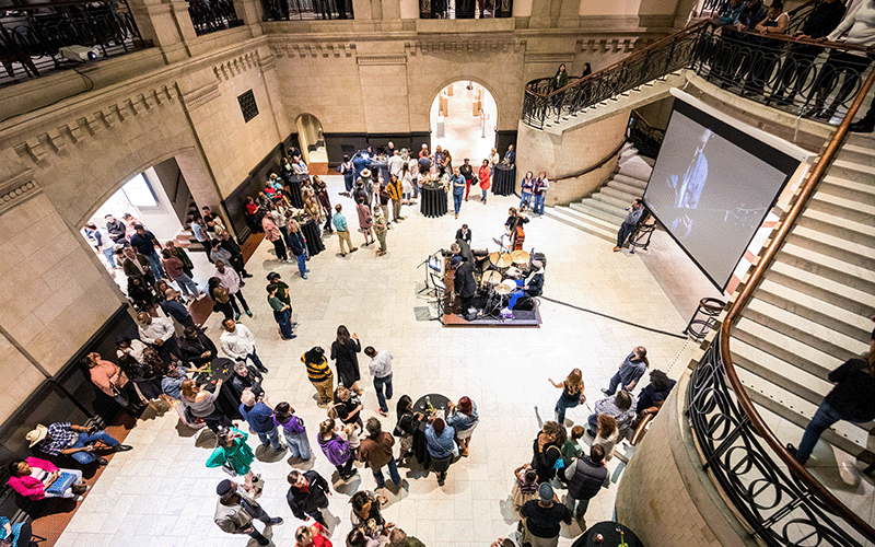 People gather in the Great Hall for Art After Dark