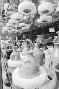 a large collection of ceramics in storage