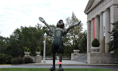 a picture of Pinnocio in front of the museum's front entrance