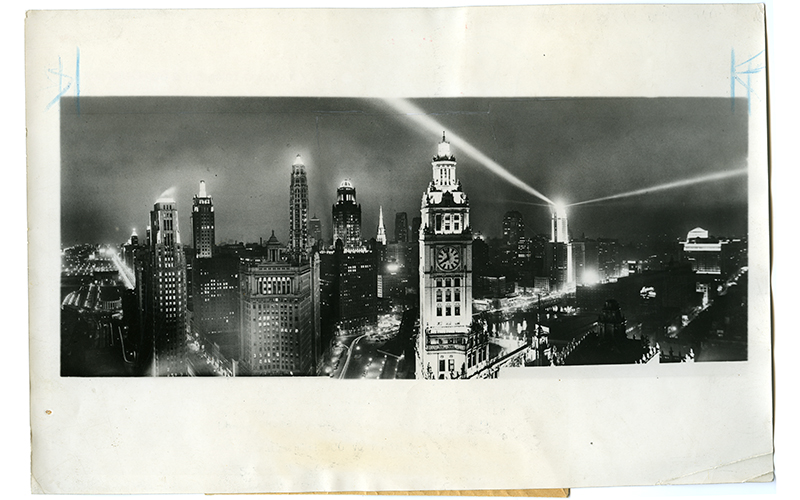 A city filled with the glowing lights of skyscrapers and electric streetlamps