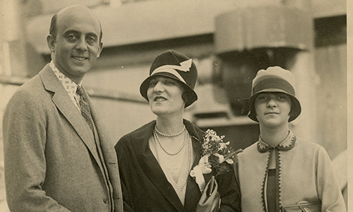 1920s era black and white photograph of a man, woman, and teenage girl. 