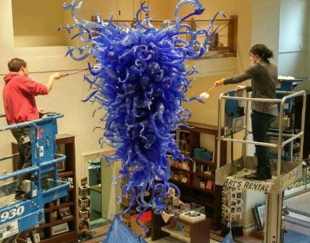 Dale Chihuly's Rio Delle Torreselle Chandelier, being hung in the main entrance to CAM