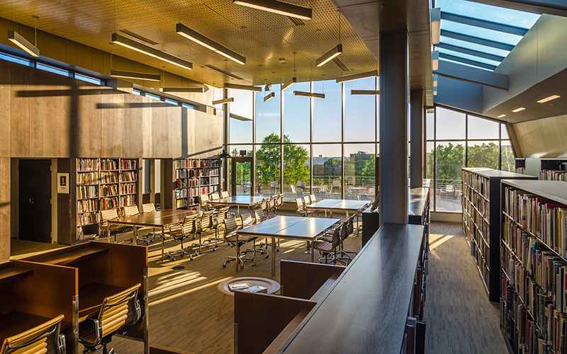 A picture of the library in the afternoon, featuring huge picture windows